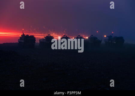 Australian Army soldiers from the 2nd Cavalry Regiment engage targets with Australian Army Light Armoured Vehicles by night on a live fire range during Exercise Rim of the Pacific 2016. (Australian Defence Force photo by Cpl. Matthew Bickerton) Stock Photo