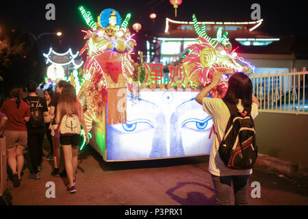 Buddhist devotees taking photo of the procession vehicles outside the PPMS buddhish temple, Kajang Malaysia, on wesak day 2016. Stock Photo