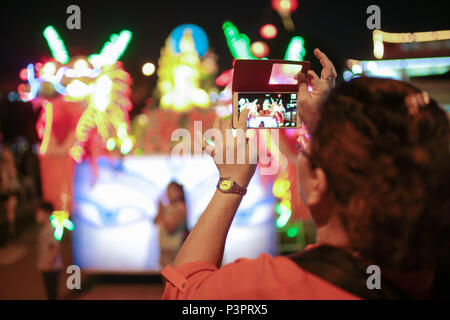 Buddhist devotees taking photo of the procession vehicles outside the PPMS buddhish temple, Kajang Malaysia, on wesak day 2016. Stock Photo