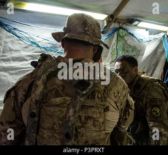 A Naval Special Warfare operator from U.S. Special Operations Command coordinates with a Tactical Air Control Party in the U.S. Army 2nd Cavalry Regiment's tactical operations center during Saber Junction 17. Exercise Saber Junction 17 is a U.S. Army Europe-directed exercise designed to assess the readiness of the Army’s 2nd Cavalry Regiment to conduct unified land operations alongside NATO Allies and partners. Stock Photo