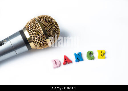 Microphone on a white background with a word of colorful letters. Stock Photo