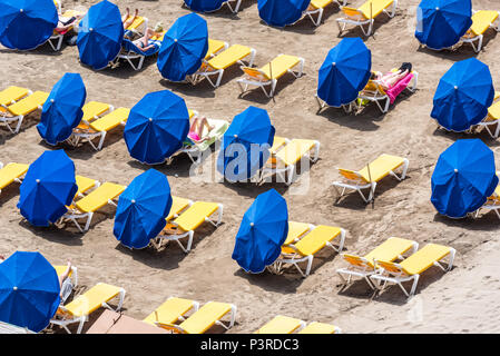 Parasol at sunny beach Stock Photo
