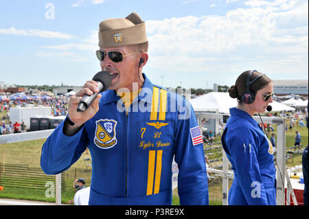 160723-N-WJ386-287  SIOUX FALLS, S.D. (July 23, 2016) U.S. Navy flight demonstration squadron, the Blue Angels, key influencer pilot and narrator Lt. Tyler Davies speaks to the air show crowd at the Sioux Falls Airshow, Power on the Prairie, July 23. The Blue Angels are scheduled to perform 58 demonstrations at 30 locations across the U.S. in 2016, which is the team's 70th anniversary year. (U.S. Navy photo by Mass Communication Specialist 1st Class Andrea Perez/Released) Stock Photo