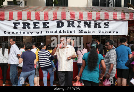 Free drinks by Maha Vihara Buddhist temple to buddhists celebrating the  wesak day on 29th May 2018 at Brickfields, Malaysia. Stock Photo