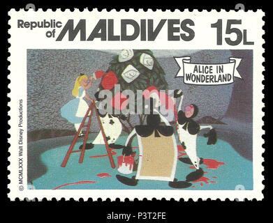 Republic of Maldives - stamp 1980: Color edition on Walt Disney, shows Alice in Wonderland decorates a tree Stock Photo