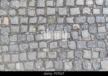 Granite cobblestone pavement background, paving stone texture Stock Photo