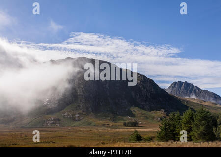 Mist in sunshine over the Glyderau mountains, Snowdonia, North Wales Stock Photo