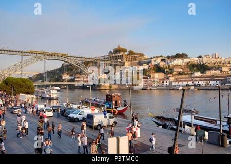 Busy Douro River waterfront in Barrio La Ribeira with view of Gaia area, Porto, Porto Region, Portugal Stock Photo