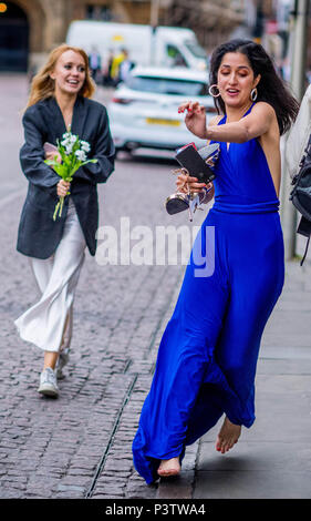 Cambridge, UK. 19th June, 2018. Trinity College Cambridge May Ball. Cambridge University students walk the streets of Cambridge after attending the Trinity College May Ball.  Picture by Andrew Parsons / Parsons Media Credit: andrew parsons/Alamy Live News Stock Photo