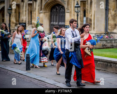 Cambridge, UK. 19th June, 2018. Trinity College Cambridge May Ball. Cambridge University students walk the streets of Cambridge after attending the Trinity College May Ball.  Picture by Andrew Parsons / Parsons Media Credit: andrew parsons/Alamy Live News Stock Photo