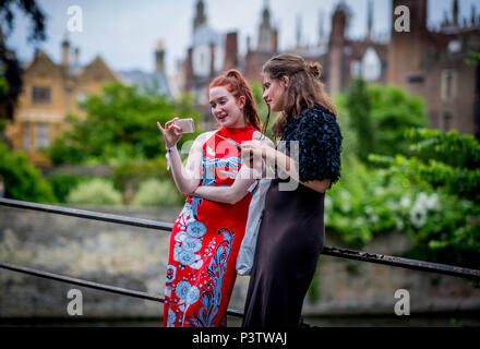 Cambridge, UK. 19th June, 2018. Trinity College Cambridge May Ball. Cambridge University students walk the streets of Cambridge after attending the Trinity College May Ball.  Picture by Andrew Parsons / Parsons Media Credit: andrew parsons/Alamy Live News Stock Photo