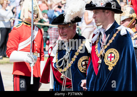 Windsor Castle, UK. 18 June 2018 - Their Royal Highnesses Prince William and Prince Charles arrive at the Order of the Garter ceremony in the grounds of Windsor Castle, UK. They were wearing full Garter regalia. Her Majesty The Queen broke with tradition and arrived by car. Credit: Benjamin Wareing/Alamy Live News Stock Photo