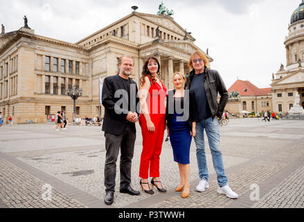 19 June 2018, Germany, Berlin: Pianist Sebastian Knauer (L-R), soprano Gunta Cese, actress and singer Katharine Mehrling and musician Dieter 'Machine' Birr, standing on the Gendarmenmarkt in front of the concert house in Berlin after the press conference for the Classic Open Air Festival 2018. The festival is taking place from the 05 to the 09 July 2018 on the Gendarmenmarkt. Photo: Christoph Soeder/dpa-Zentralbild/dpa Stock Photo