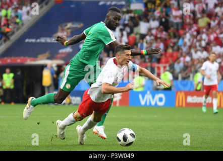 Moscow, Russia. 19th June, 2018. Soccer: World Cup 2018, group stages, group H: Poland vs Senegal at Spartak Stadium. Poland's Robert Lewandowski is stopped by Senegal's Salif Sane (L). Credit: Federico Gambarini/dpa/Alamy Live News Stock Photo