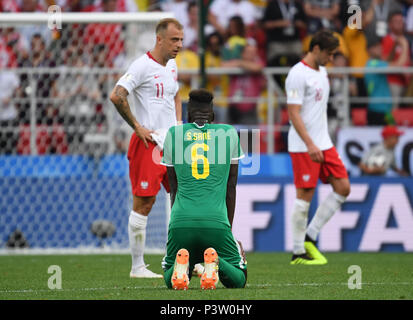 Moscow, Russia. 19th June, 2018. Soccer: World Cup 2018, group stages, group H: Poland vs Senegal at Spartak Stadium. Senegal's Salif Sane kneels on the ground. Credit: Federico Gambarini/dpa/Alamy Live News Stock Photo