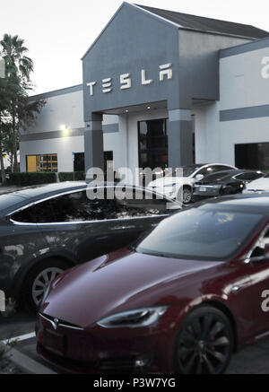 Eatonville, Florida, USA. 19th Jun, 2018. Electric cars are seen at the Tesla store in Eatonville, Florida, near Orlando on June 19, 2018. Tesla has been plagued by a number of problems as it attempts to increase its production of the Model 3 sedan to 5,000 a week by early July, in an effort to become profitable. A Tesla Model S spontaneously caught fire recently on a Los Angeles street.  Stock Photo