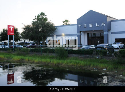 Eatonville, Florida, USA. 19th Jun, 2018. Electric cars are seen at the Tesla store in Eatonville, Florida, near Orlando on June 19, 2018. Tesla has been plagued by a number of problems as it attempts to increase its production of the Model 3 sedan to 5,000 a week by early July, in an effort to become profitable. A Tesla Model S spontaneously caught fire recently on a Los Angeles street.  Stock Photo