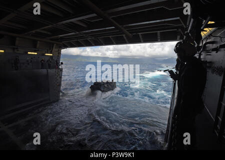 160730-N-RC734-539 PACIFIC OCEAN (July 30, 2016) - Assault amphibious vehicles depart the well deck of amphibious transport dock ship USS San Diego (LPD 22) while conducting the final amphibious assault, during of Rim of the Pacific 2016. Twenty-six nations, more than 40 ships and submarines, more than 200 aircraft and 25,000 personnel are participating in RIMPAC from June 30 to Aug. 4, in and around the Hawaiian Islands and Southern California. The world's largest international maritime exercise, RIMPAC provides a unique training opportunity that helps participants foster and sustain the coop Stock Photo