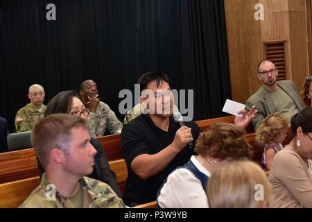 A spectator asks a question July 28 during the Transformation Town Hall at U.S. Army Garrison Yongsan in Seoul. (Photo by Tim Oberle, Eighth Army Public Affairs) Stock Photo