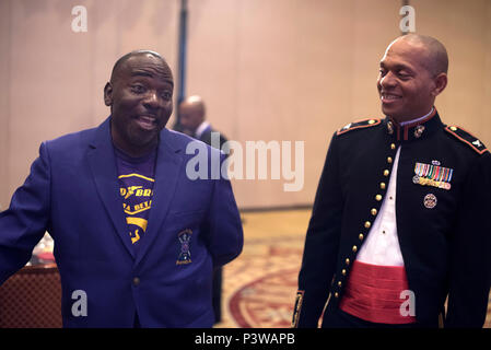 Col. Reginald L. Hairston talks with fraternity members during the