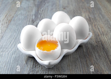 Six Large White Eggs on a White Ceramic Dish Stock Photo