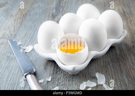 Six Large White Eggs on a White Ceramic Dish Stock Photo