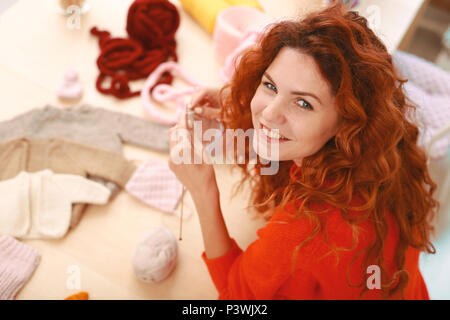 Red-haired woman smiling broadly feeling extremely happy Stock Photo