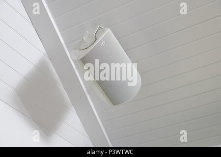 Polk outdoor audio speakers for music and sound in the elements on a porch Stock Photo