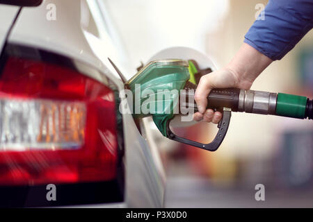 Refueling the car at a gas station fuel pump Stock Photo