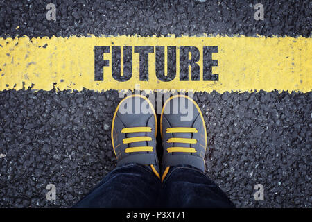 Future line child in sneakers standing next to a yellow line Stock Photo