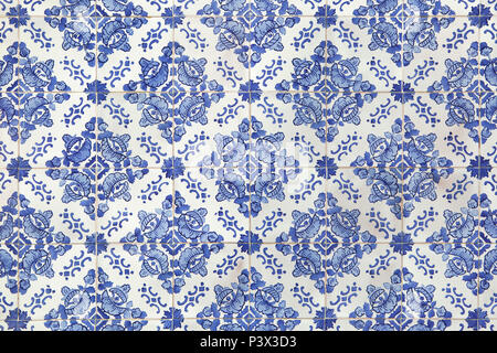 Traditional Portuguese azulejo tiles on the building in Porto, Portugal. Background texture. Stock Photo