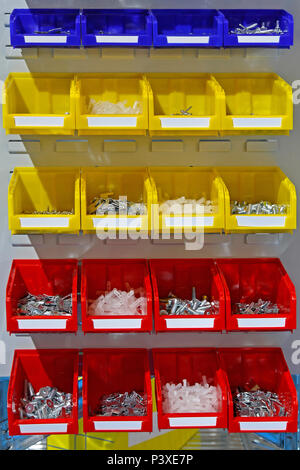 Colourful Plastic Sorting Bins With Nuts and Bolts Stock Photo