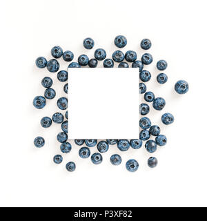 Creative layout with fresh ripe berries. Blueberry isolated on white background with white square for copy space. Can use for your design, promo, social media. Top view. Instagram format square. Stock Photo