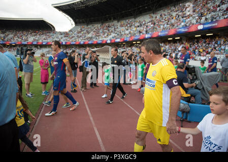 CLUJ, ROMANIA - JUNE 16, 2018: Football player Gheorghe Hagi (Romania Golden Team) and Barcelona Legends entering the playfield at the beginning of a  Stock Photo