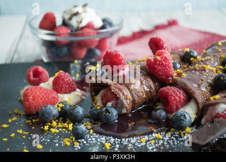 Gourmet Chocolate Crepes-Closeup food photos. Shot at various angles, overhead, vertical, horizontal. Sweet dessert or special breakfast. Stock Photo