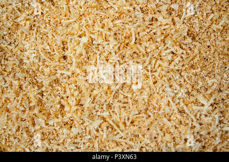 Fresh sawdust texture. Shavings background with copyspace Stock Photo