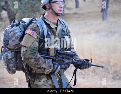 Oregon Army National Guard Soldier, 1st Lt. Matthew Shepergerdes, with 2nd  Battalion, 162nd Infantry, 41st Infantry Brigade Combat Team completes the  last 100 meters of a 12-mile ruck march, as part of an Expert Infantryman  Badge event (EIB), held at ...