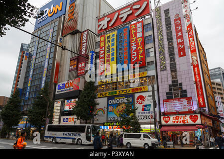 Akihabara streets with stores and pedestrians, a shopping district for video games, anime, manga, and computer goods Stock Photo