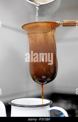 Preparo de café em coador de pano. Stock Photo