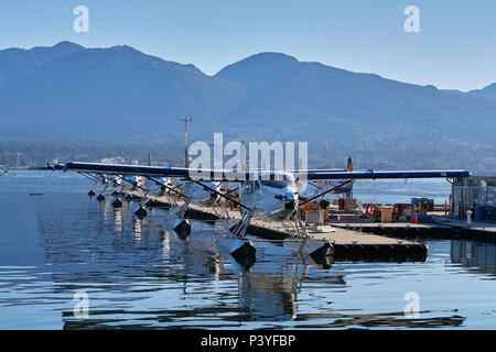 Harbour Air Seaplanes de Havilland Canada DHC-3-T Turbo Otter Fleet Moored At The Vancouver Harbour Flight Centre, Vancouver, BC, Canada. Stock Photo