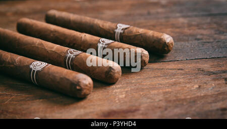 Cuban cigars on wooden background, copy space Stock Photo