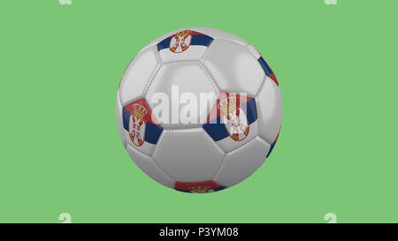 Soccer ball with Serbia flag isolate on a green background, 3D rendering Stock Photo