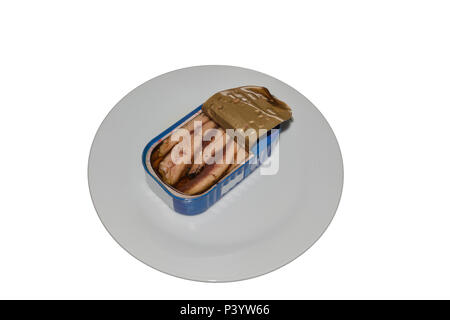 Can of sardines on a white plate with a slice of bread. Stock Photo