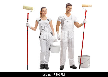 Full length portrait of a female and a male painter with buckets and paint rollers isolated on white background Stock Photo