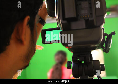 Behind the scene. Actor in front of the camera on the film set outdoor ...
