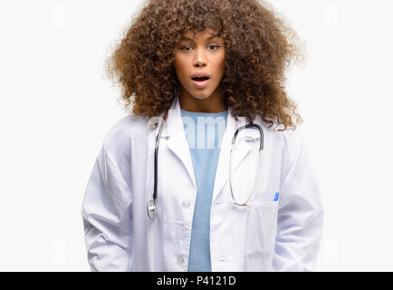 African american doctor woman, medical professional working scared in shock, expressing panic and fear Stock Photo