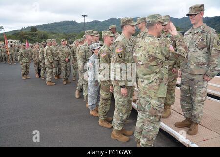 WAHIAWA, Hawaii – During a Materiel Readiness Award Ceremony, here, more than 70 Soldiers and civilians receive awards and/or brigade coins for their contributions during the Stryker turn-in process on June 1, 2016. Brigadier Gen. Patrick Matlock, 25th Infantry Division’s Deputy Commanding General-Support joined Col. David Womack, Command Sgt. Maj. T.J. Holland, the command team for 2nd Inf. Bde. Combat Team, and the rest of the Warrior Brigade Battalion’s Command Teams, as they praised the Soldiers for their hard-work and dedication during the transition process. Stock Photo