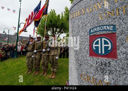 SAINT MERE EGLISE, France (June 02, 2016) Members of the 82nd Sustainment Brigade Color Guard participate in the Airborne Troops Monument Memorial Ceremony, June 2. More than 380 service members from Europe and affiliated D-Day historical units are participating in the 72nd anniversary as part of Joint Task Force D-Day 72. The Task Force, based in Saint Mere Eglise, France, is supporting local events across Normandy, from May 30 – 6 June , 2016 to commemorate the selfless actions by all the allies on D-Day that continue to resonate 72 years later. (U.S. Navy photo by Mass Communication Special Stock Photo