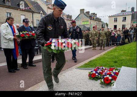 SAINT MERE EGLISE, France (June 02, 2016) Lt. Gen. Timothy Ray, commander 3rd Air Force, lays a ceremonial wreath at the Airborne Troops Monument, June 2, during a Memorial Ceremony. More than 380 service members from Europe and affiliated D-Day historical units are participating in the 72nd anniversary as part of Joint Task Force D-Day 72. The Task Force, based in Saint Mere Eglise, France, is supporting local events across Normandy, from May 30 – 6 June , 2016 to commemorate the selfless actions by all the allies on D-Day that continue to resonate 72 years later. (U.S. Navy photo by Mass Com Stock Photo