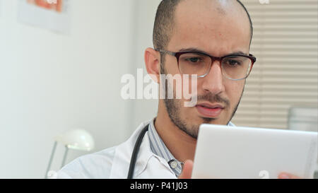 Male medical worker using digital tablet Stock Photo